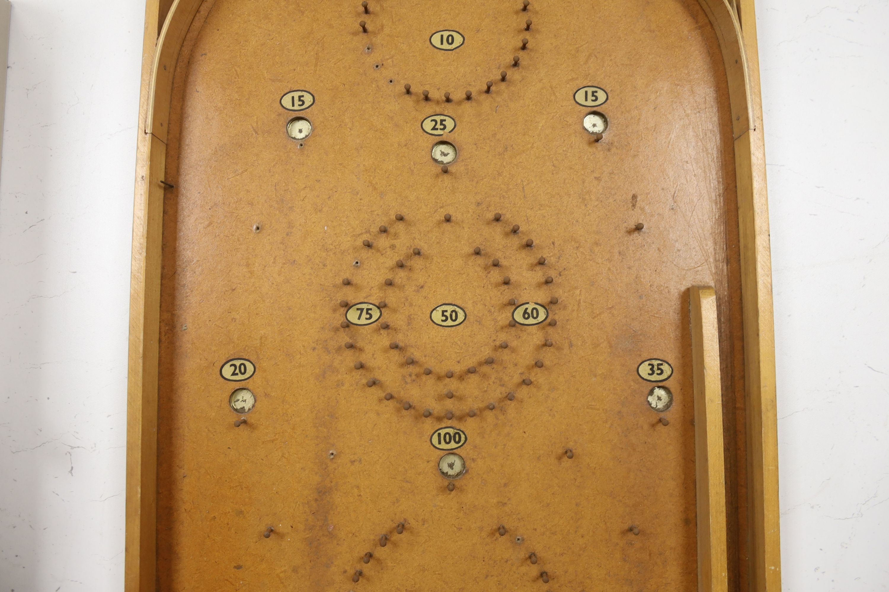 A vintage bird scarer and a Chad Valley bagatelle board